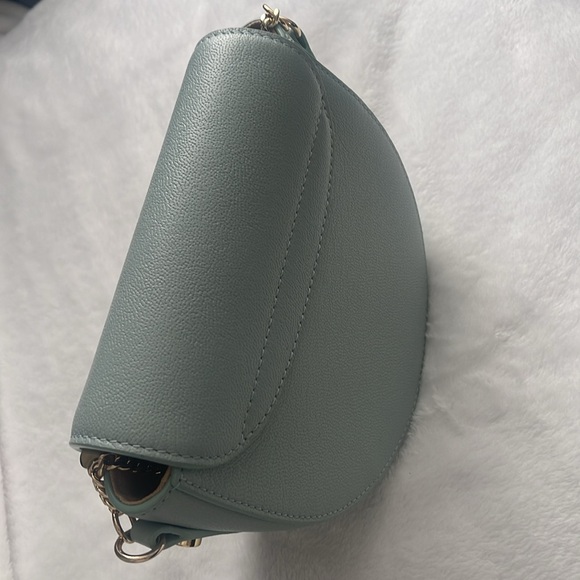 A high-shine bar adds definition to the half-circle silhouette of this elegant. - Picture 5 of 6